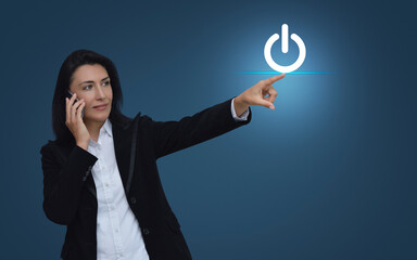 Businesswoman hand press power button icon over light blue background, Start up business concept