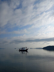 Fishing boat on the sea in the morning, Thailand. Ocean landscape.  
