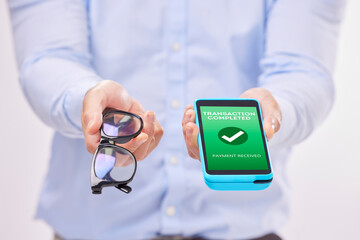 Man, hands and phone with transaction approval or glasses for ecommerce or purchase against a white studio background. Hand of male holding spectacles and mobile smartphone for electronic payment