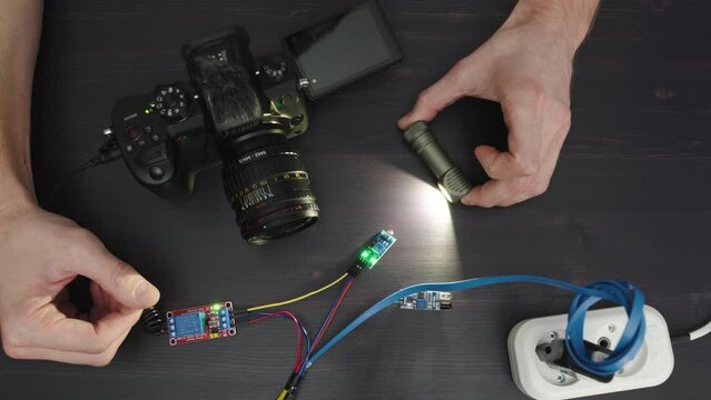 Photocell photoresistor sensor triggering shutter release and electronic relay on mirrorless camera