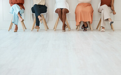 Fototapeta na wymiar Feet, interview and business women waiting in line for their meeting with human resources during recruitment. Legs, hiring and candidate with a group of people sitting in a row at an agency for hr