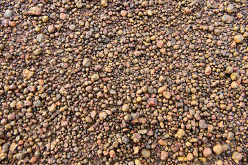 brown radiation ball soil layer It is a problematic soil layer, hard topsoil, not suitable for cultivation. gravel soil background concept
