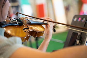 Violinist. Hands of a violinist playing a violin orchestra instrument close-up, playing music