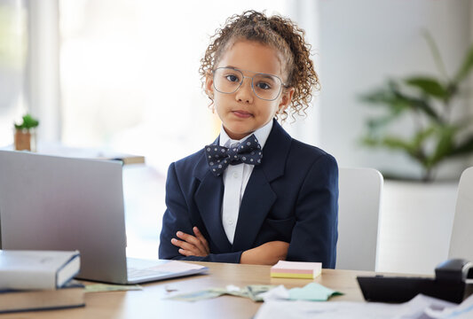 Girl child, arms crossed and portrait in office with annoyed face for game, playing and learning. Kid, boss and games in workplace with serious expression, glasses and focus for goals at business