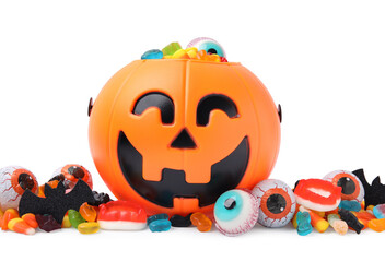 Halloween trick or treat bucket with different sweets on white background