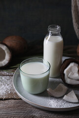 Obraz na płótnie Canvas Composition with coconut milk on wooden table