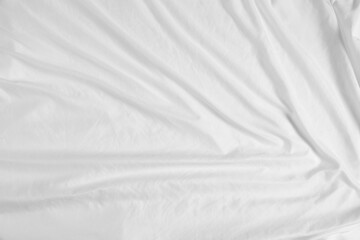 Crumpled white fabric as background, top view