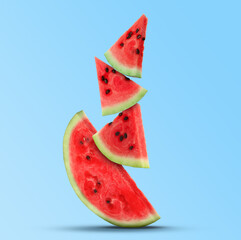 Stack of juicy watermelon slices on light blue background - obrazy, fototapety, plakaty