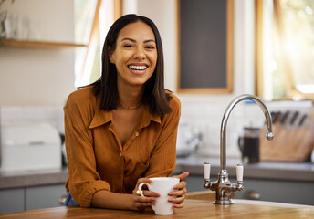 Happy, coffee and woman portrait at home in a kitchen with a hot drink feeling relax and calm in the morning. Happiness, zen and female drinking in a house holding a mug in a household with tea
