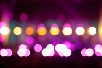 Festive purple spotted glitter background. Defocus blurred abstract purple bokeh background. Blurry...
