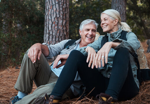 Nature, smile and hiking, old couple on floor in forest in South Africa on retirement holiday adventure. Travel, senior man and woman relax together on outdoor walk with love, happiness and health.