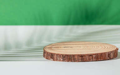 Wooden podium with leaves shadows. nature scene with pedestal mockup. Floral silhouette
