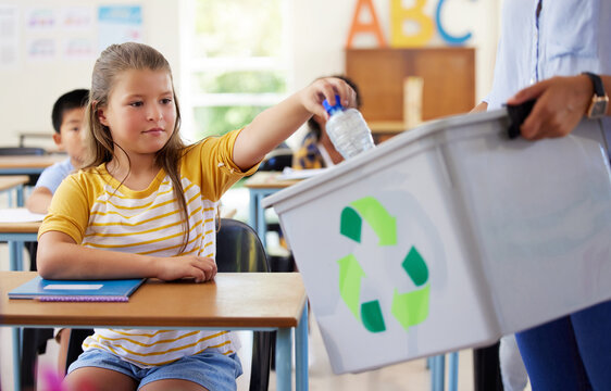 Child, classroom and recycling plastic bottle with teacher for ecology, future and climate change education. Girl, box and recycle at school, class or helping hand for environment, earth and learning - Powered by Adobe