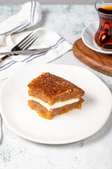 Bread kadayif with cream. Bread kadayif stuffed with cream in the middle. Traditional Turkish cuisine delicacies. close up. Local name ekmek kadayifi