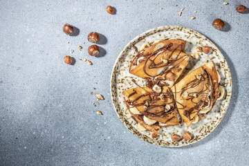 crepes with banana and chocolate. breakfast or dessert. banner, menu, recipe place for text, top view