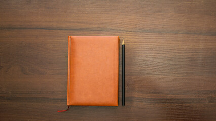 Notebook and pencil on a beautiful background in a photo studio