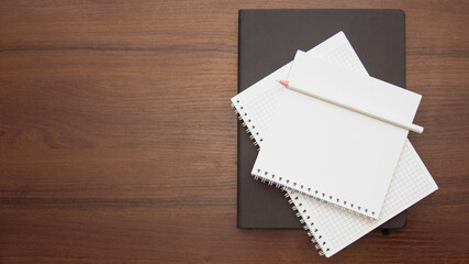 Notebook and pencil on a beautiful background in a photo studio