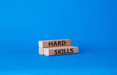Hard skills symbol. Wooden blocks with words Hard skills. Beautiful blue background. Business and Hard skills concept. Copy space.