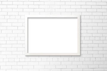 Poster Mockup with White Frame on White Brick Wall