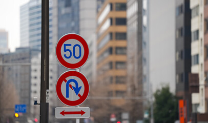 Japanese traffic signs. Various traffic signs to show the speed limits or pedestrian cross on the streets of Tokyo. Transportation industry.