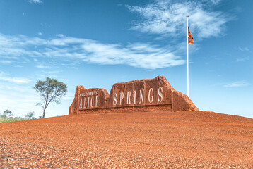 Sign of Alice Springs stands in the desert in the outback in Northern Territory