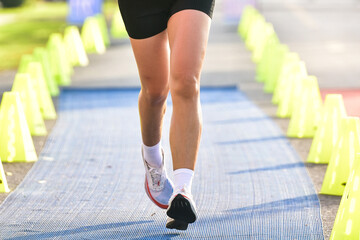 Marathon Running In The Light Of Morning, People Running On City Road Detail On Legs.