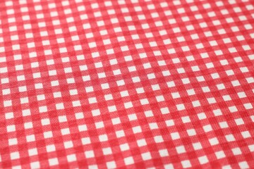 Red checkered tablecloth as background, closeup view