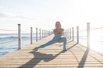 woman exercising on pontoon Red Sea