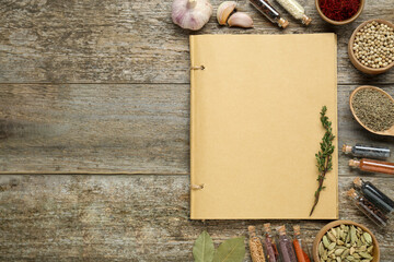Blank recipe book and different ingredients on old wooden table, flat lay. Space for text
