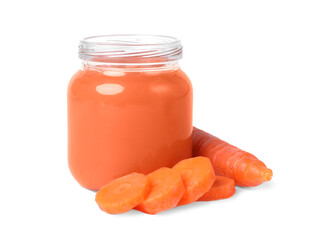 Jar of healthy baby food and carrot slices on white background