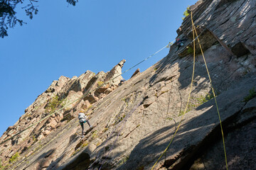 Climber training on natural terrain. Rock climbing in nature