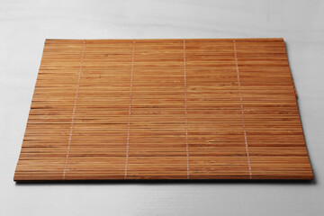 New clean bamboo mat on beige table