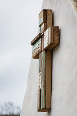 Wooden cross on old house