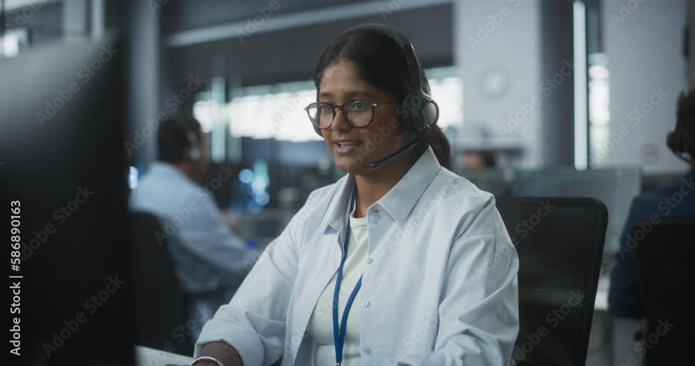 Aufkleber Portrait of a Help Desk Specialist Having a Conversation on a Call, Providing Technical Support to Client Experiencing Software Issues. Indian Female Using a Headset to Talk with a Tech Team