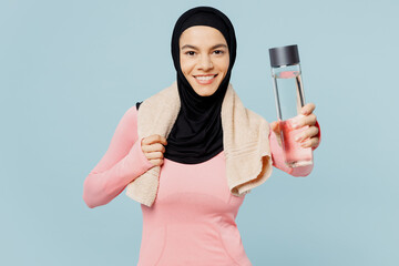 Young arabian asian muslim fitness trainer sporty woman wear pink abaya hijab towel spend time in...