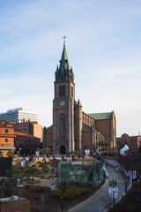 Fototapeta premium Myeongdong Catholic Cathedral locate at Myeongdong shopping street during winter sunny day at Jung-gu , Seoul South Korea : 2 February 2023