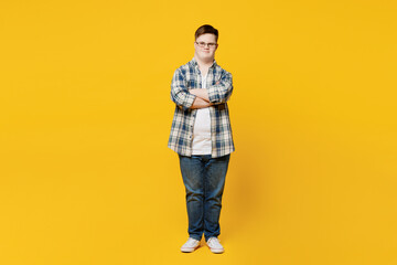Full body young smiling man with down syndrome wears glasses casual clothes look camera hold hands...