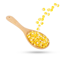 Corn seeds in wooden spoon falling in the air isolated on transparent background. PNG