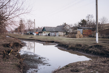 Dirty spring puddle in the village