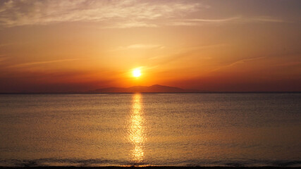 Fototapeta premium sunset seen from the boat 夕陽と海
