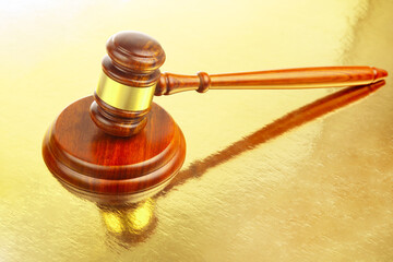 wooden hammer for auctions, bidding and judicial law. symbol of justice and verdict
