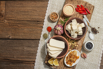 Set of ingredients for preparation Tofu. Fresh diced cheese, spices, herbs and soy sauce