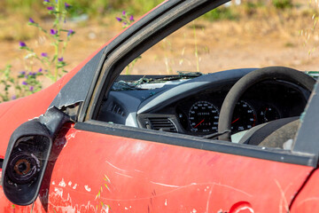 Closeup of Abandoned Red Car Left to Rust and Decay on Roadside