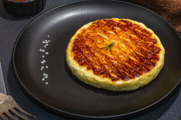 Grilled Halloumi cheese served on plate. Cutlery, traditional food for picnic or BBQ