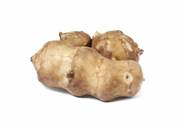 Three raw Jerusalem artichokes isolated on white