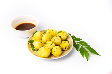 Homemade indian breakfast snacks with sauce and green sweet leaves