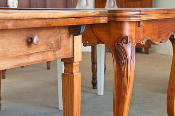 Detail of an old carved italian wooden table just restored