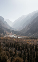 Fototapeta premium The photo showcases a breathtaking panoramic view of a beautiful mountain gorge on a sunny autumn day.