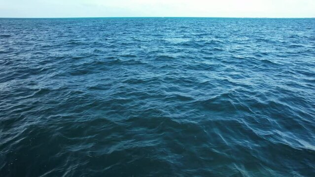 Flying over the waters of the Gulf of Mexico. Located in Cancun, Mexico. Aerial 4K drone video