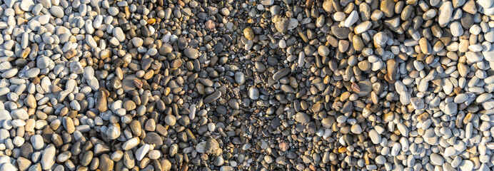 Colored pebble beach texture background